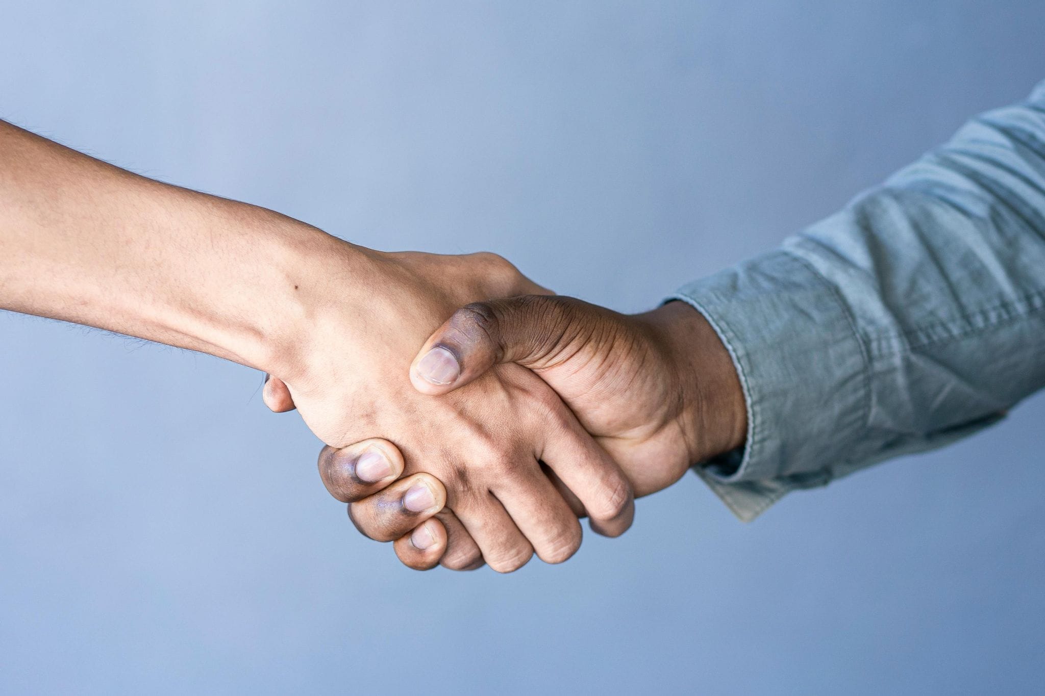Close-up of a friendly, professional handshake