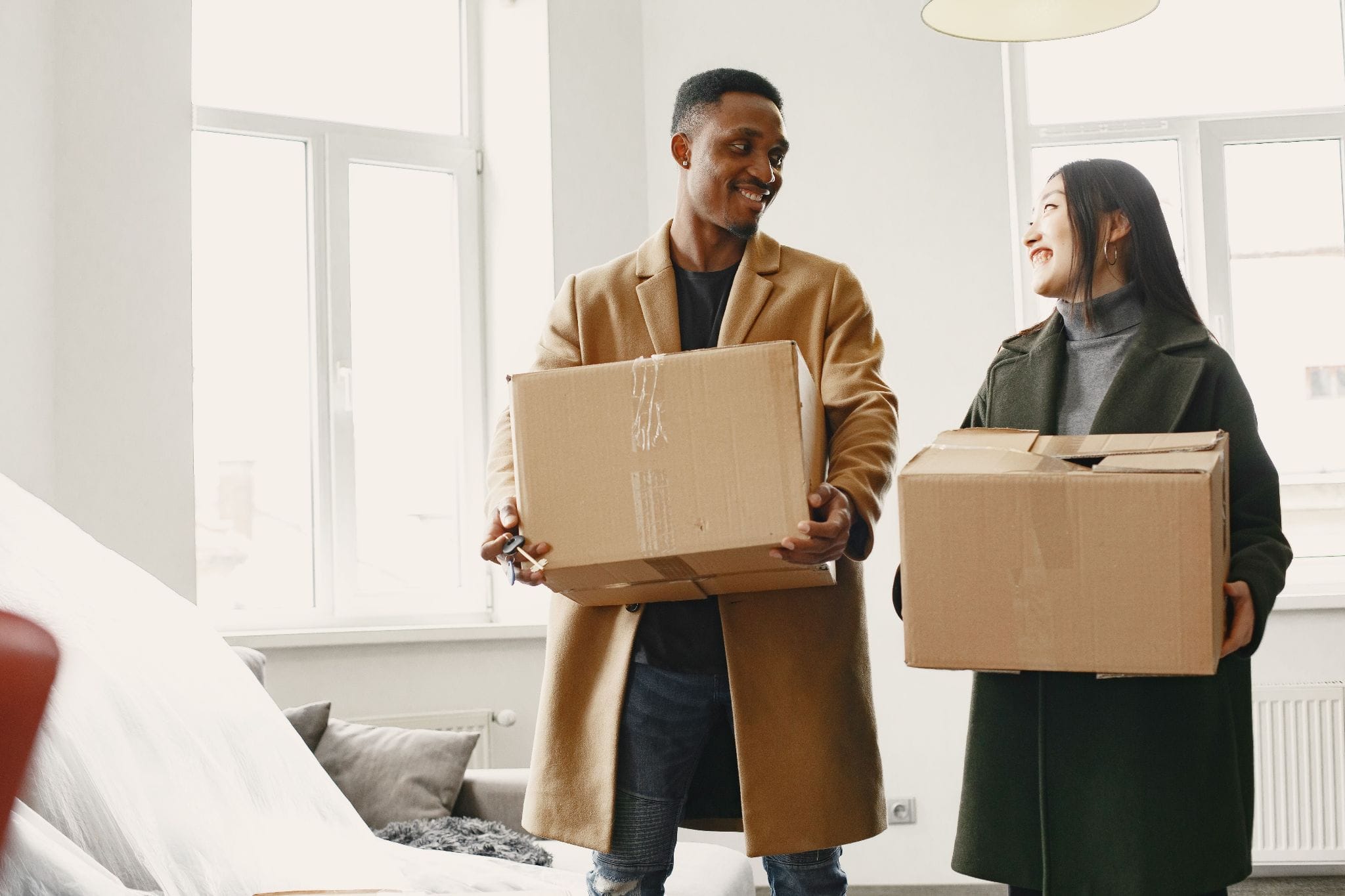 Tenants carrying boxes as they move into a Chula Vista rental